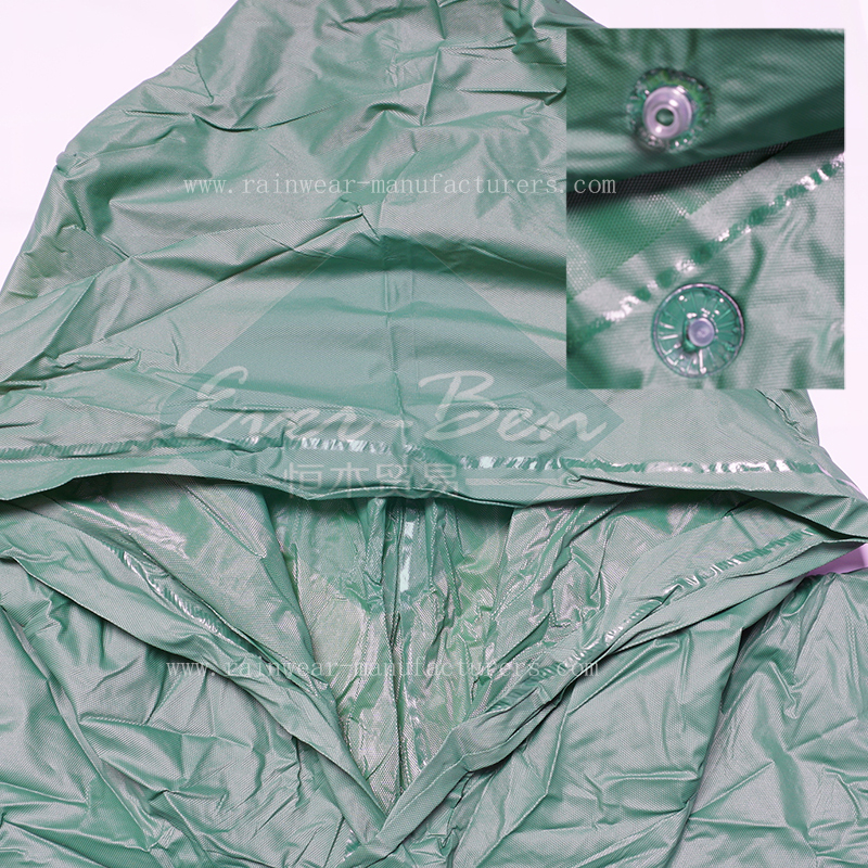 Green hooded PVC rain poncho